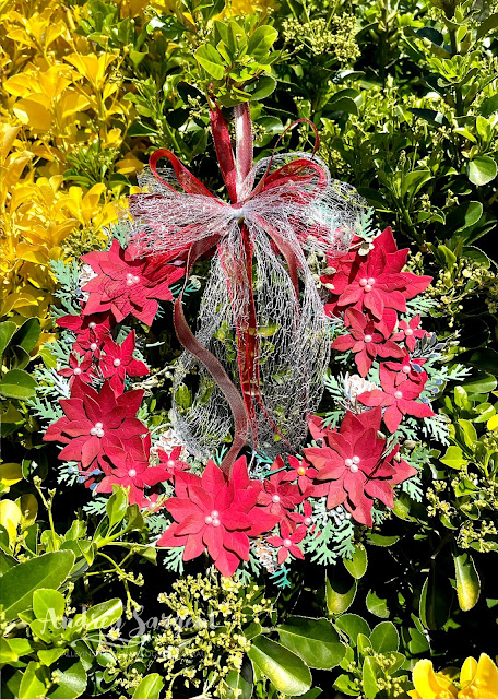 Create a Christmas Poinsettia Wreath yourself to welcome guests coming into your home like Andrea Sargent in Australia.