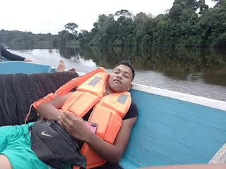 " Sleeping during a boat trip in the Amazone Jungle Suriname"