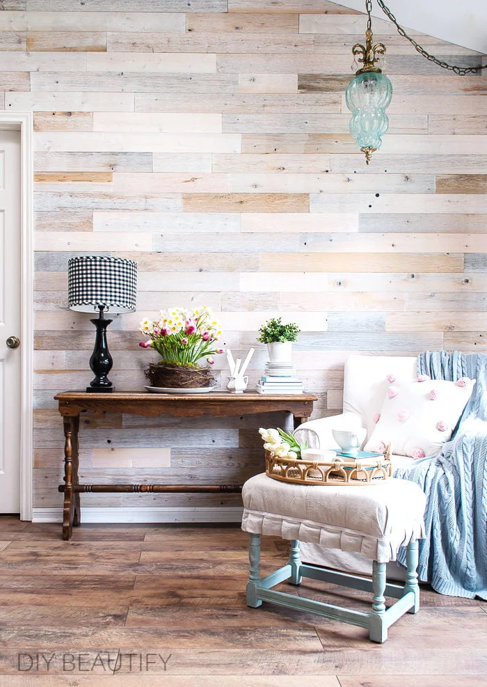 wood wall, Spring decorated console table and neutral furnishings