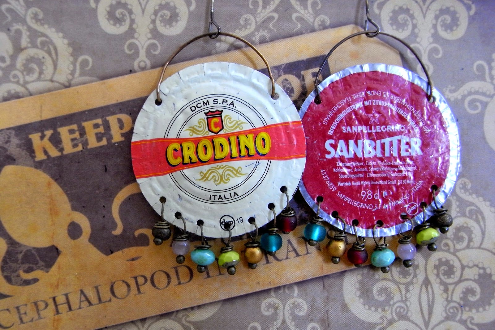 http://saraccino.blogspot.com/2014/10/tin-tales-earrings-made-from-bottle-caps.html