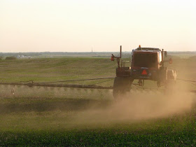 Picture of tractor spraying crops in a field