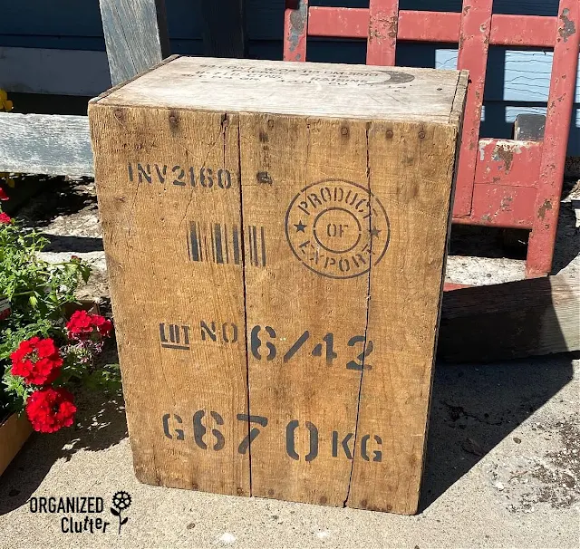 Photo of an old crate bottom stenciled with Pallet Stamps stencil from Old Sign Stencils.