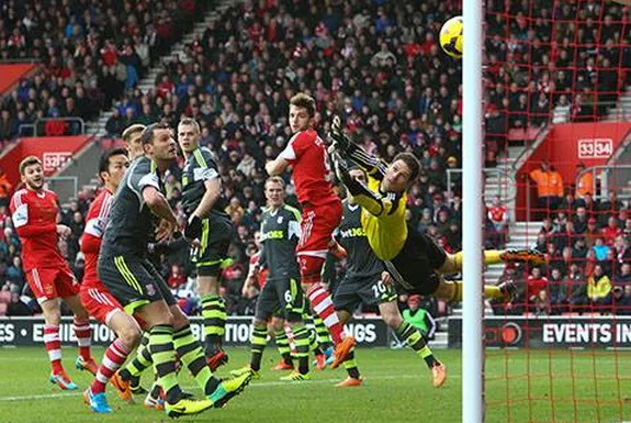 Southampton player Rickie Lambert scores his team's opening goal against Stoke from a free-kick