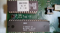 An 80C32 microprocessor and external 27256 EEPROM holding the firmware.