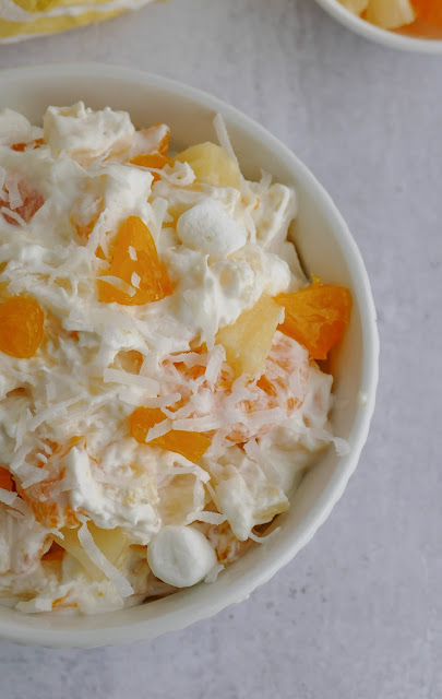 5 Cup Salad in a white bowl with a gray background.