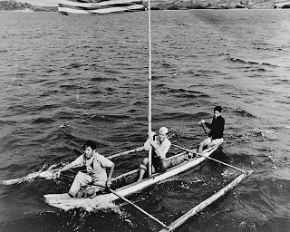 Filipino soldiers on a banca to meet US forces in the 1945 Nasugbu Landing. Photo credit: US Naval History & Heritage Command.