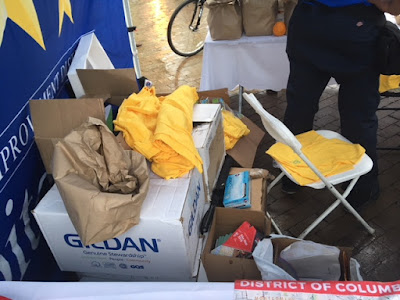 boxes containing bright yellow t-shirts