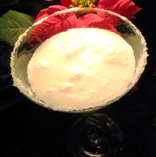 Coconut Snowball Martini: Classic festive cocktail of cream, vanilla vodka, coconut rum and cream of coconut served in a martini glass