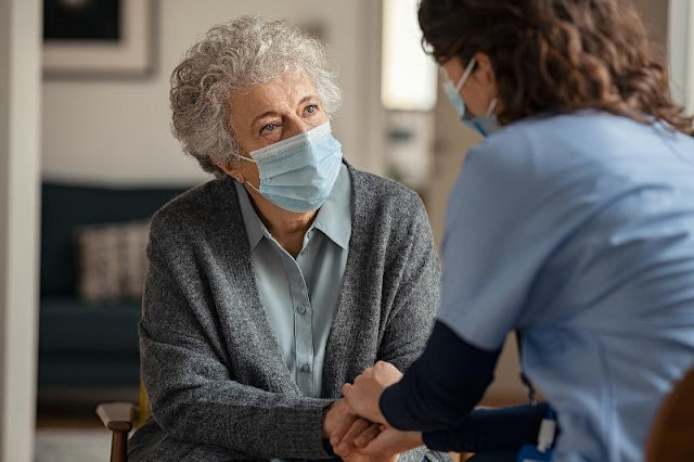 Elderly woman trusts the help of her home caregiver