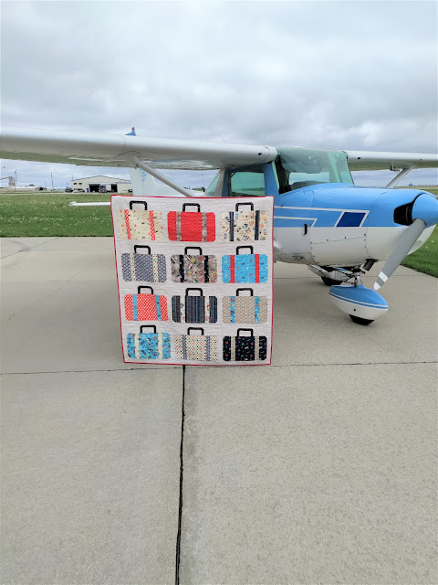 Suitcases quilt made with Pan Am fabric by Riley Blake