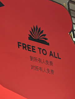 A red sign that says "Free to all" in English with Chinese writing under it
