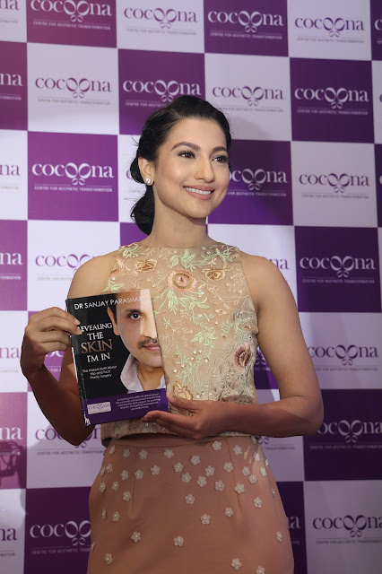 Gauahar Khan with Dr. Sanjay Parashar's book Revealing the Skin I am In