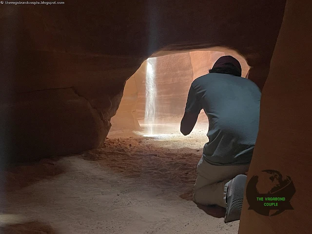 A beam of sunlight reaches the floor of Antelope Canyon at Canyon X, Antelope Canyon, Navajo Nation, Arizona, USA
