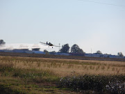 Driving down the highway I noticed some model airplane flying. (pa )