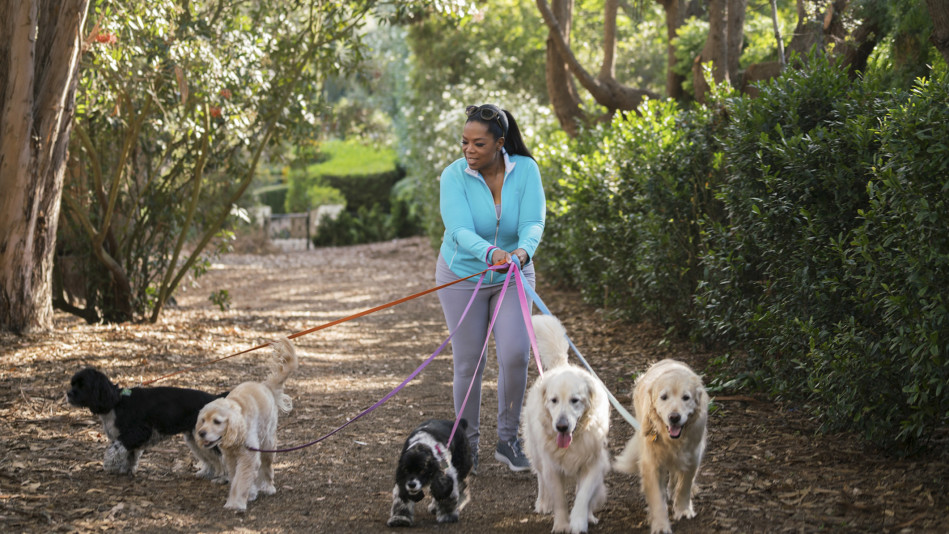 Oprah Winfrey with her five dogs Sadie, Sunny, Lauren, Layla, and Luke