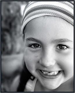 Girl in Hat smiling, Toronto portrait photographer Robert Rafton