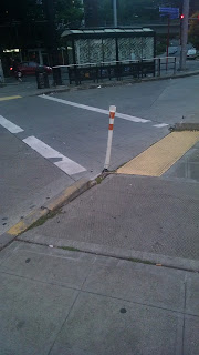 Pole by yellow dome strip