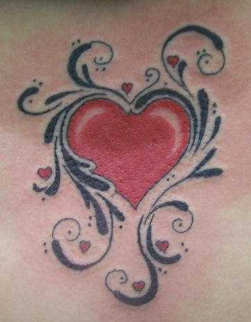 Red heart with black pattern tattoo