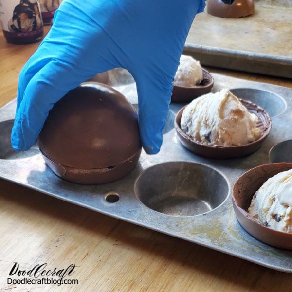 Then quickly place the melted chocolate edge on/over the ice cream bomb, sealing the chocolate domes into one beautiful sphere.