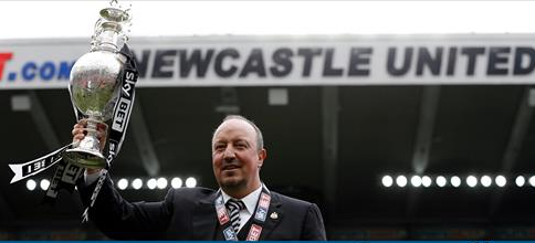 Rafa Benitez holding up Newcastle United's Championship winners cup in St. James' Park