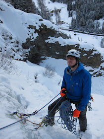 At the belay while ice climbing in Autria