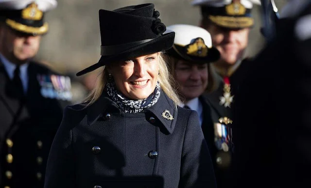 The Countess of Wessex wore a navy Military long coat by Max Mara. LK Bennett London Belle black suede boot