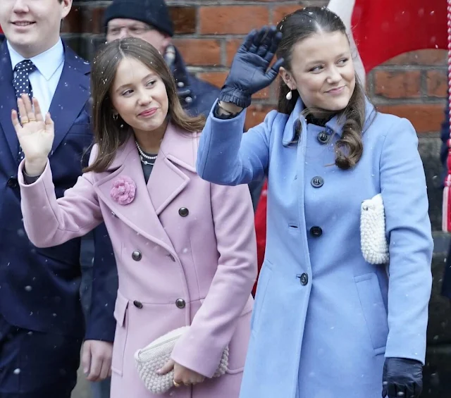 Princess Isabella wore a blue coat by Prada, Princess Josephine wore a pink coat by Andiata, Queen Mary wore a blue coat dress