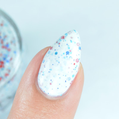 white nail polish with red white blue glitter