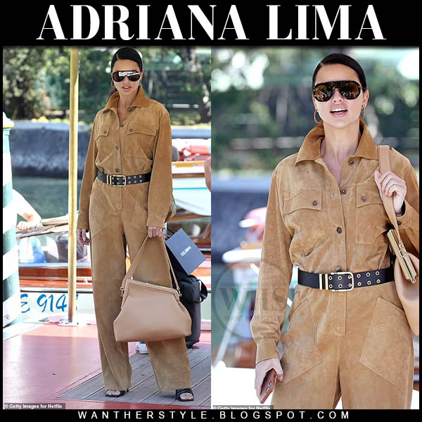 Adriana Lima in camel suede jumpsuit with camel leather bag at Venice Film Festival
