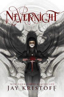 Cover of Nevernight, featuring a masked girl with long, dark hair. She stands against a white stone wall carved with coats of arms, her blood-drenched hands clasped around a white dagger. Shadowy wings rise from her shoulders.