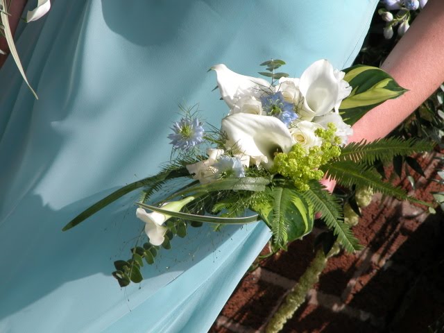 The Bridesmaids were wearing a shade of Turquoise Aquamarine which looked 