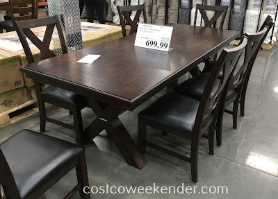 Furnish your dining room with the Bayside Furnishings 9-piece Dining Set