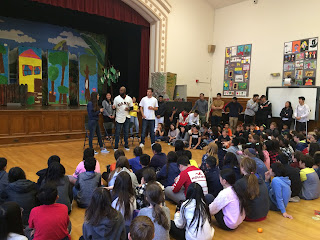 San Francisco Giants player Austin Jackson stands with students at Lafayette Elementary School