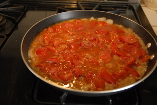 pan of simmering tomaotes