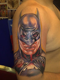 batman tattoo on the shoulders of men