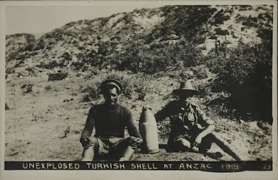 Two soldiers with unexploded Turkish shell