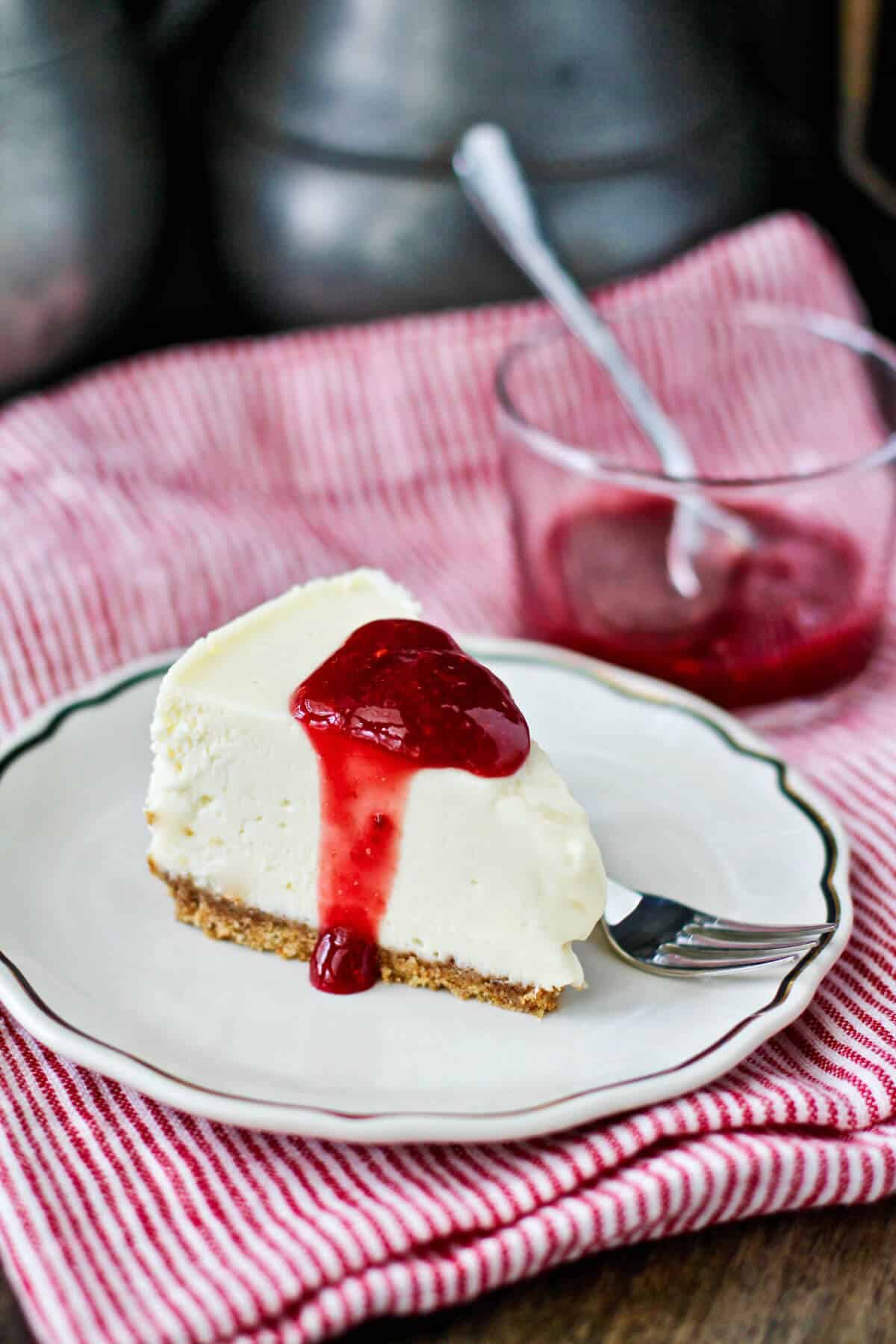 Instant Pot Vanilla Cheesecake with raspberries.