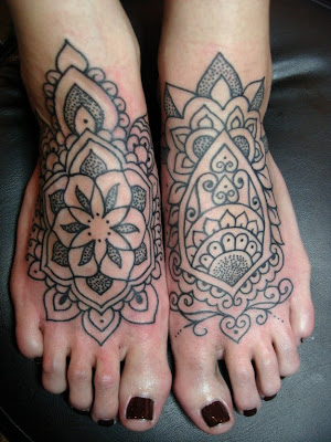 Comments: Feminine tattooed feet inspired by henna patterns.