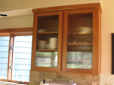 Kitchen Doors Glass on Upper Kitchen Cabinets Feature Reed Glass Wood Framed Doors   Above