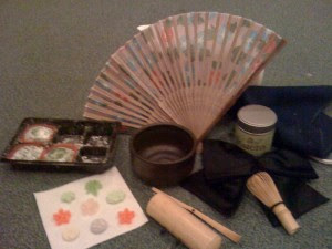 magical items for a Japanese witch including a fan, bowl, tea cup  and other things