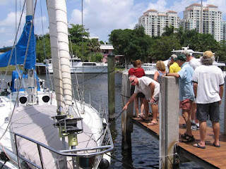 Caribe, a Beneteau First 456, is pulled over to the pier by John Kretschmer