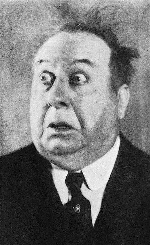 a photograph of film comedian Mack Swain overacting for laughs, shock, fear, surprise