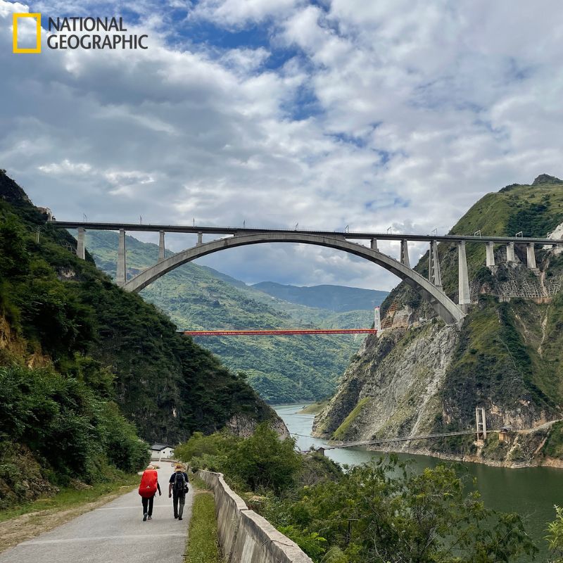 A view of the Mekong River in Songpo, Yunnan, China with a high-speed rail line over the Mekong River depicting the new infrastructure transforming Yunnan. The photo is by Paul Salopek