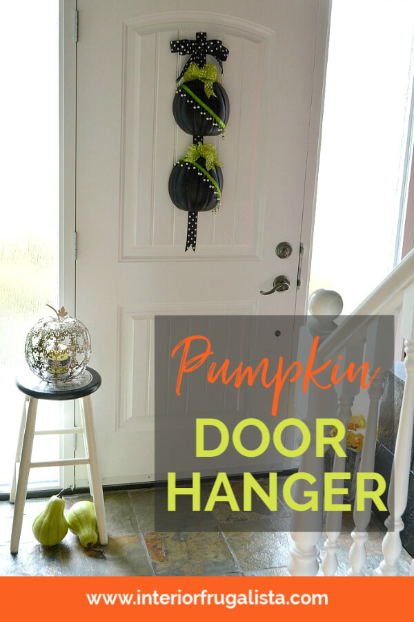 An easy peasy Halloween half pumpkin door hanger that won't scare trick or treaters made with craft pumpkins and assorted green and black ribbon. #diypumpkincraft #doorhangerdiy