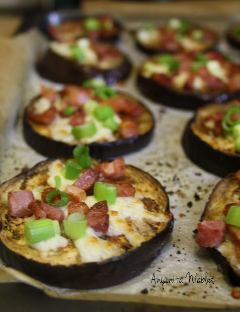 Eggplant and Pancetta Individual Pizzas topped with cheese and scallions from www.anyonita-nibbles.com