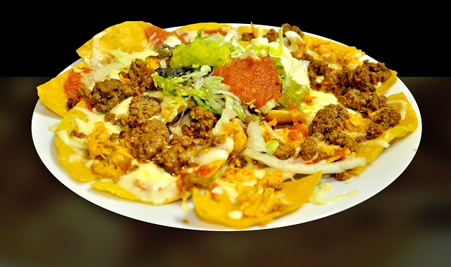 Platter of Super Nachos: Corn chips with taco meat, cheese, and salsa