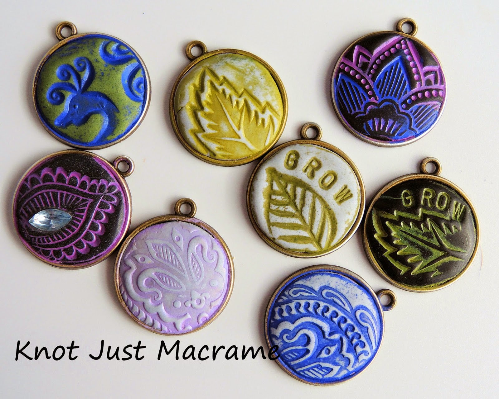 Epoxy clay charms stamped and antiqued with Vintaj patinas