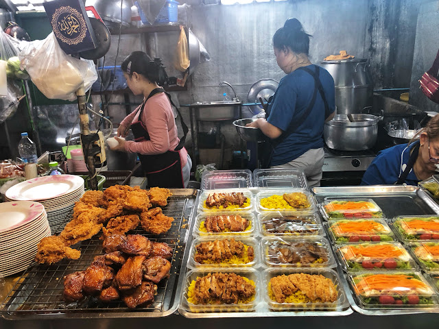 fried and roasted chicken yellow rice biryani rice shop in Bangkok, Thailand