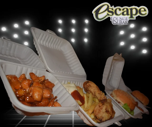 "Spicy chicken, hamburger, fried chicken and fries from restaurant Escape in Paramaribo"