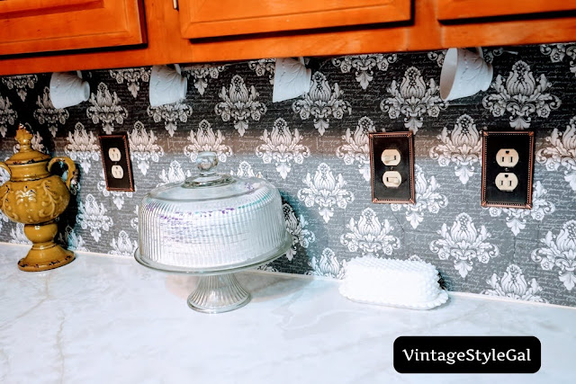 teacups hanging from bottom of cupboard in kitchen